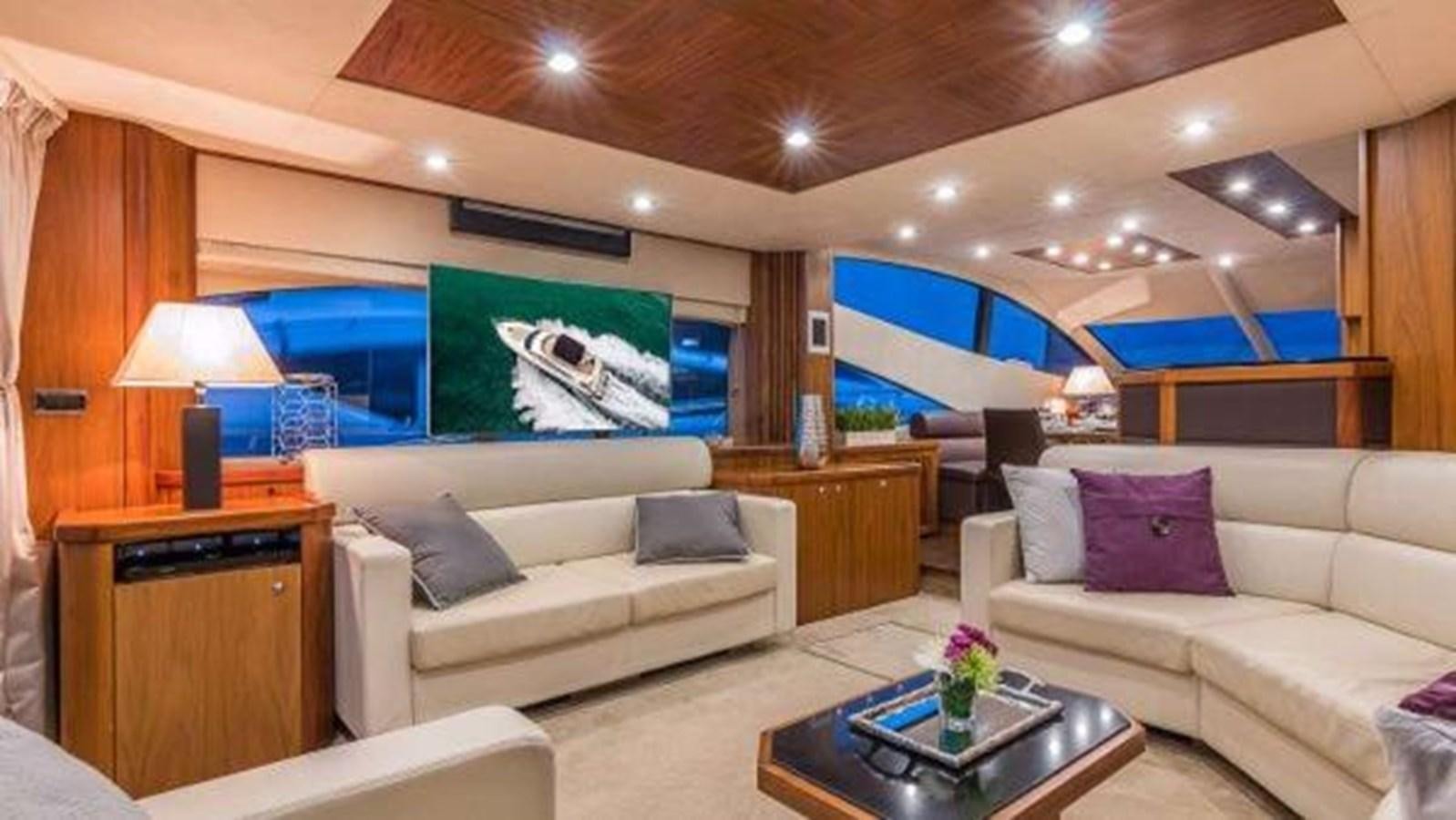 a living room with a couch and a tv aboard TWINS Yacht for Sale