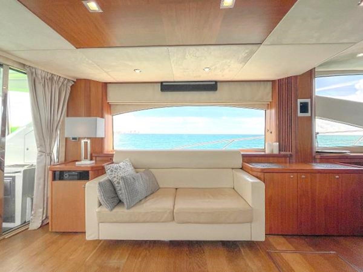 a living room with a large window aboard TWINS Yacht for Sale