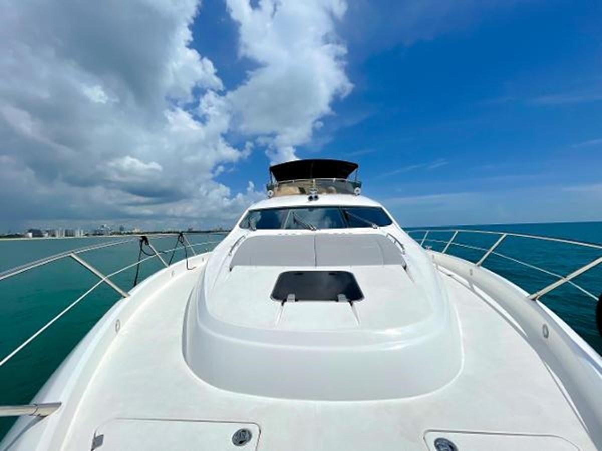 a white car on a road aboard TWINS Yacht for Sale