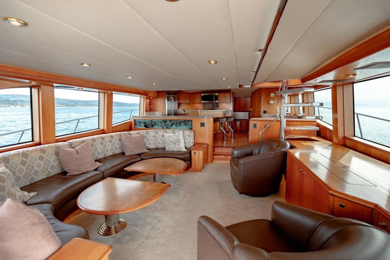 a living room with a couch and a table aboard PRIME TIME Yacht for Sale