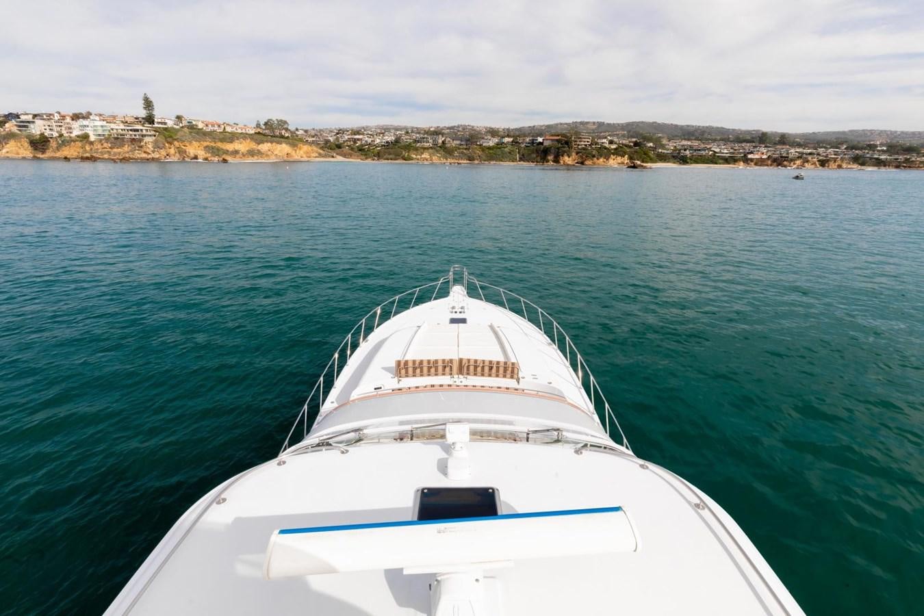 a white boat in the water aboard PRIME TIME Yacht for Sale
