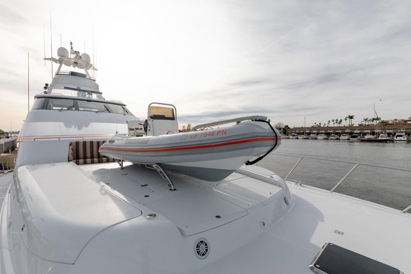 a couple of boats on a dock aboard PRIME TIME Yacht for Sale