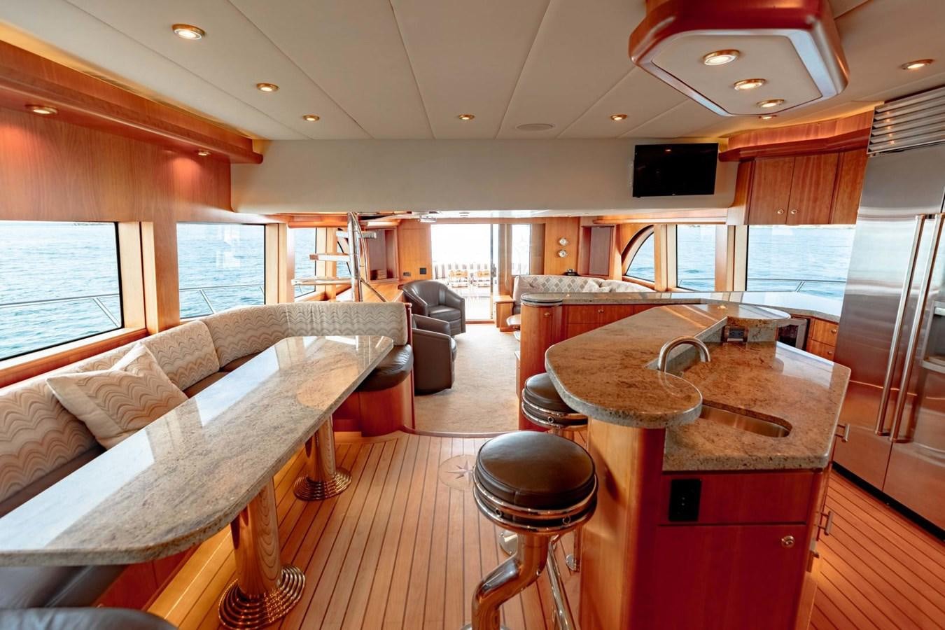 a living room with a couch and a table aboard PRIME TIME Yacht for Sale
