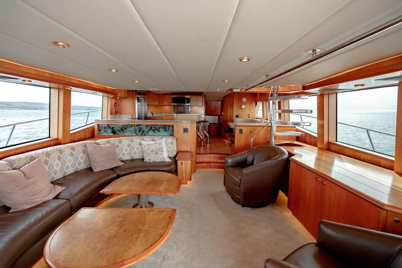 a living room with a couch and a table aboard PRIME TIME Yacht for Sale
