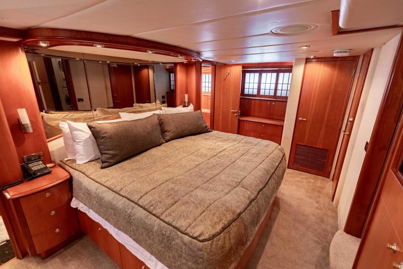 a bed in a room aboard PRIME TIME Yacht for Sale