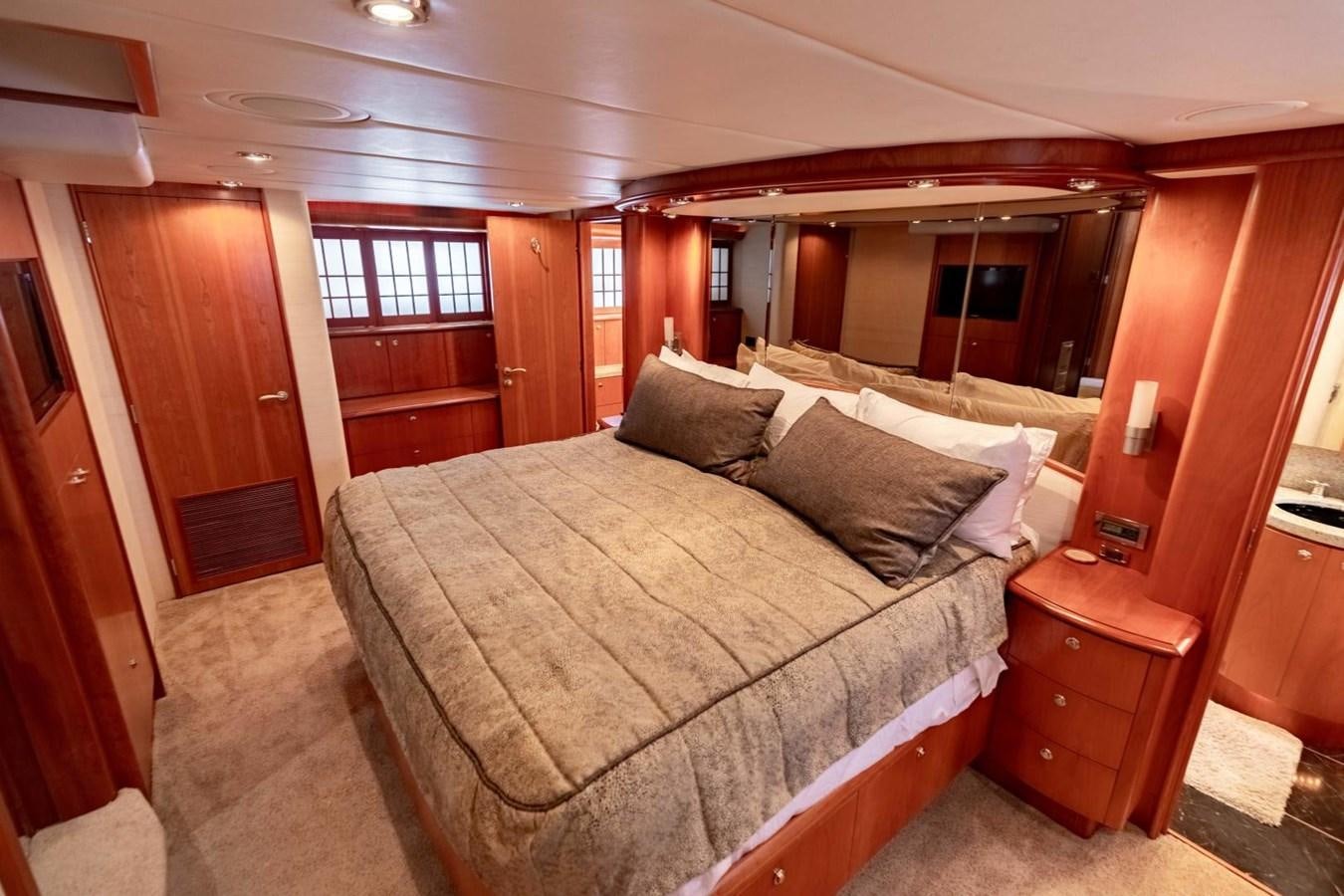 a bed in a room aboard PRIME TIME Yacht for Sale