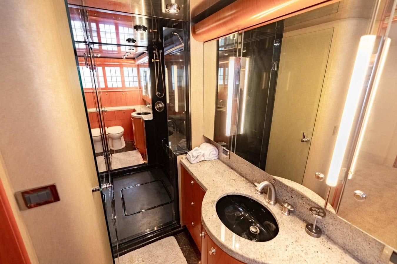 a bathroom with a sink and a mirror aboard PRIME TIME Yacht for Sale