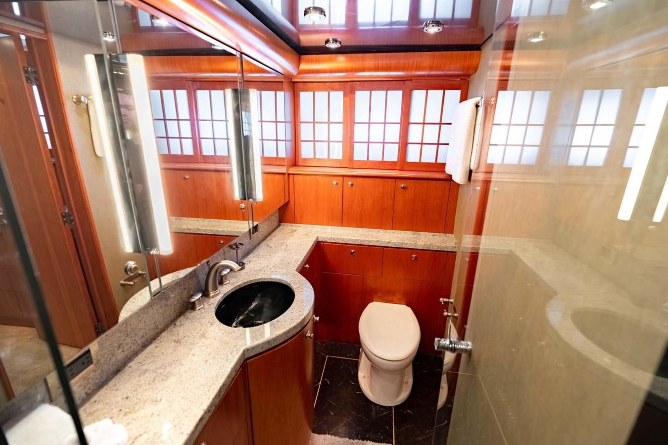a bathroom with a sink toilet and a bathtub aboard PRIME TIME Yacht for Sale
