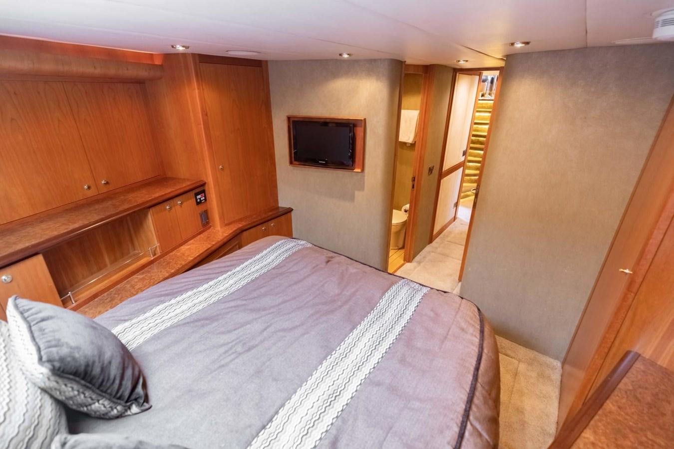 a bed in a room aboard PRIME TIME Yacht for Sale