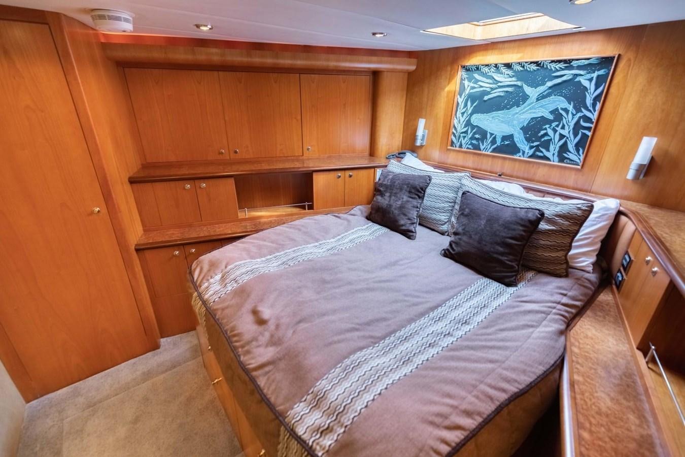a bed in a room aboard PRIME TIME Yacht for Sale