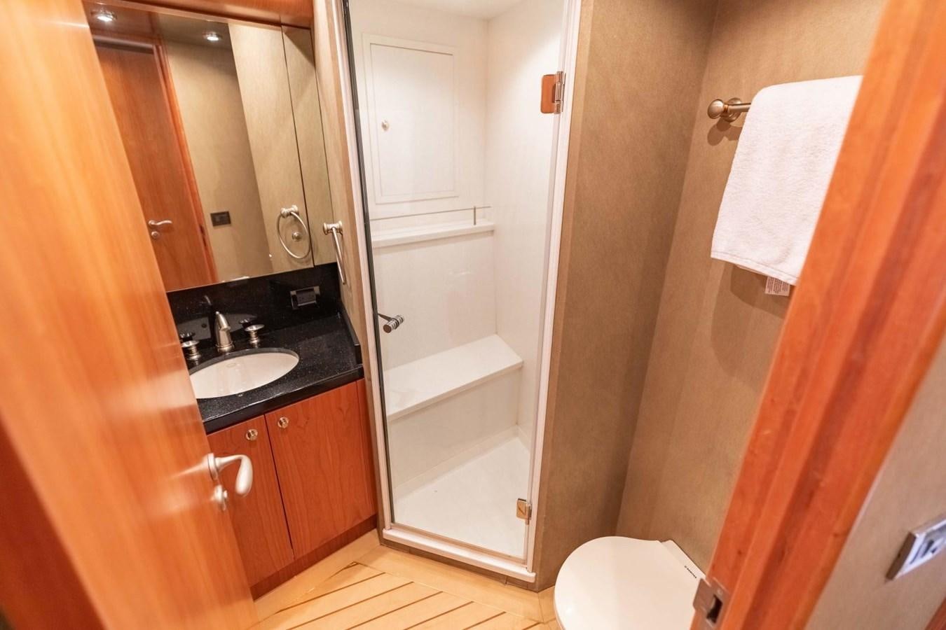 a bathroom with a sink and a toilet aboard PRIME TIME Yacht for Sale