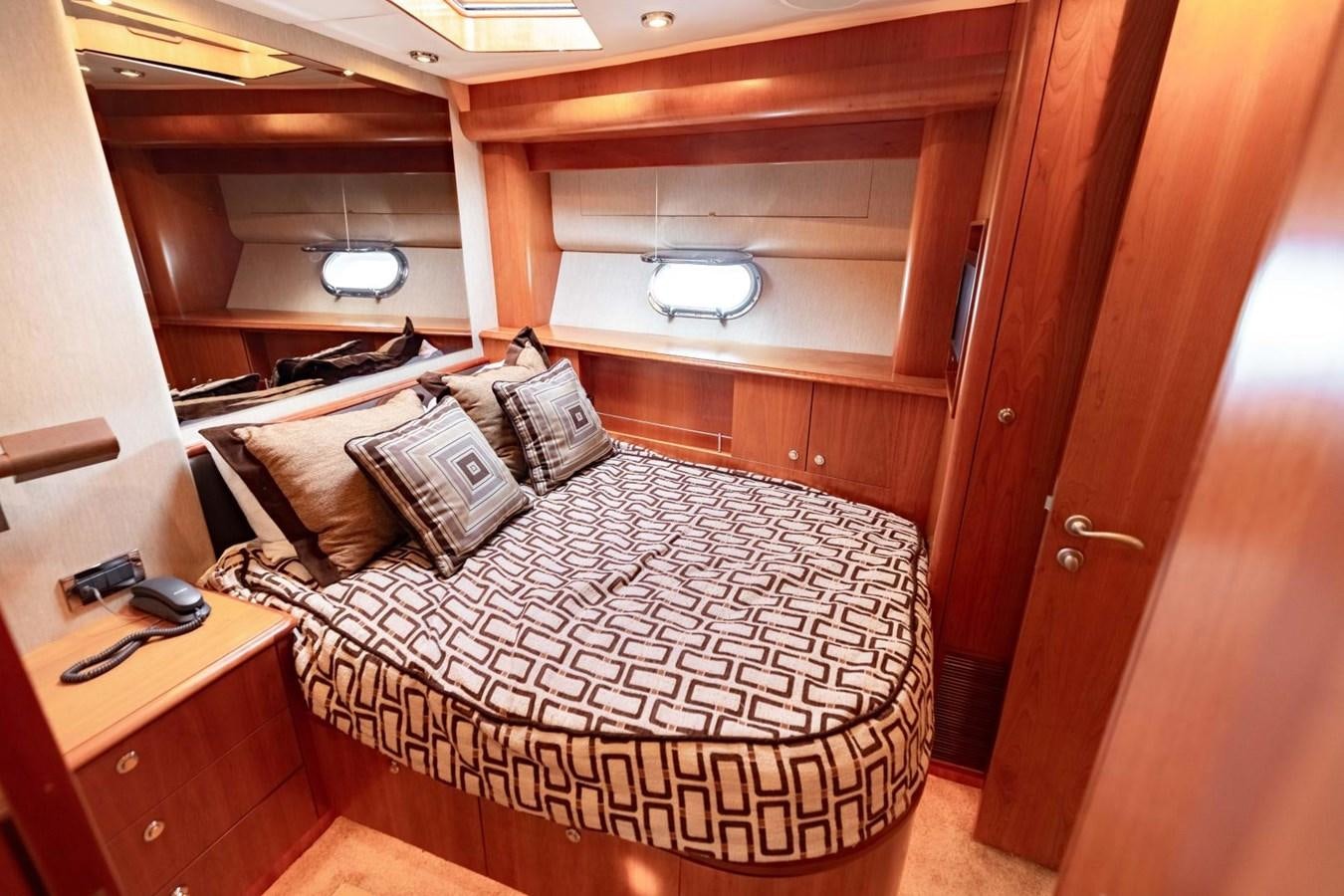 a bed in a room aboard PRIME TIME Yacht for Sale