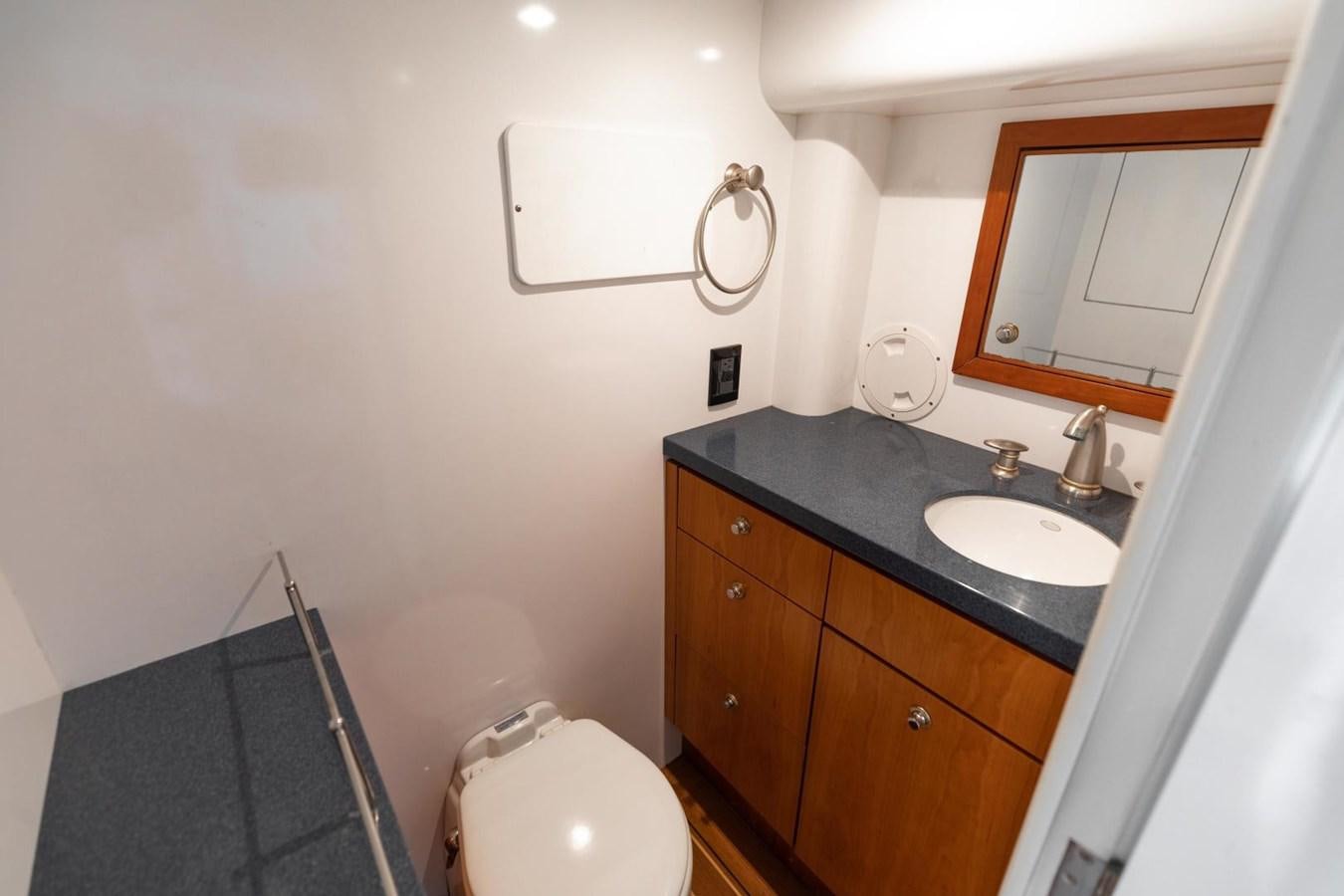 a bathroom with a sink and a toilet aboard PRIME TIME Yacht for Sale