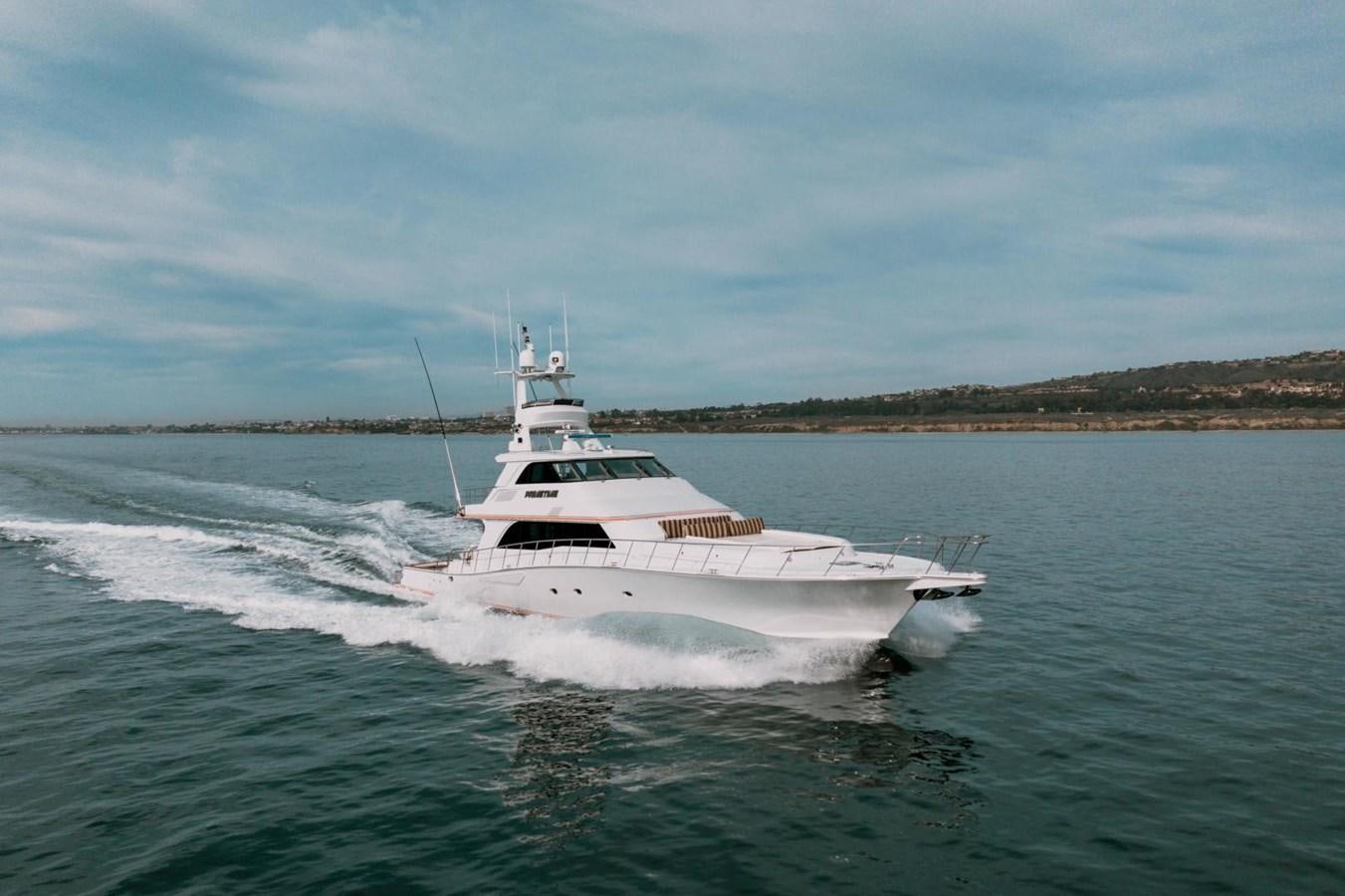 a white boat on water aboard PRIME TIME Yacht for Sale