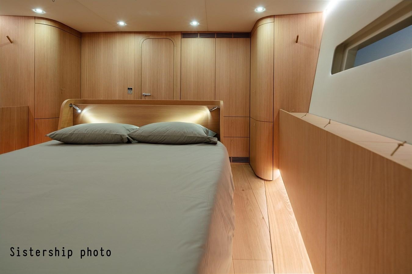 a bed in a room aboard Y7-70 Yacht for Sale