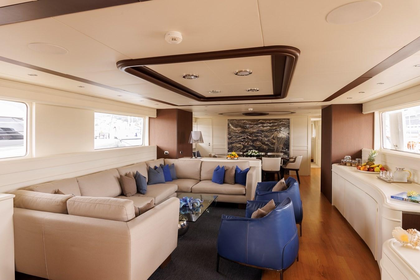 a living room with a couch and a table aboard DON CIRO Yacht for Sale