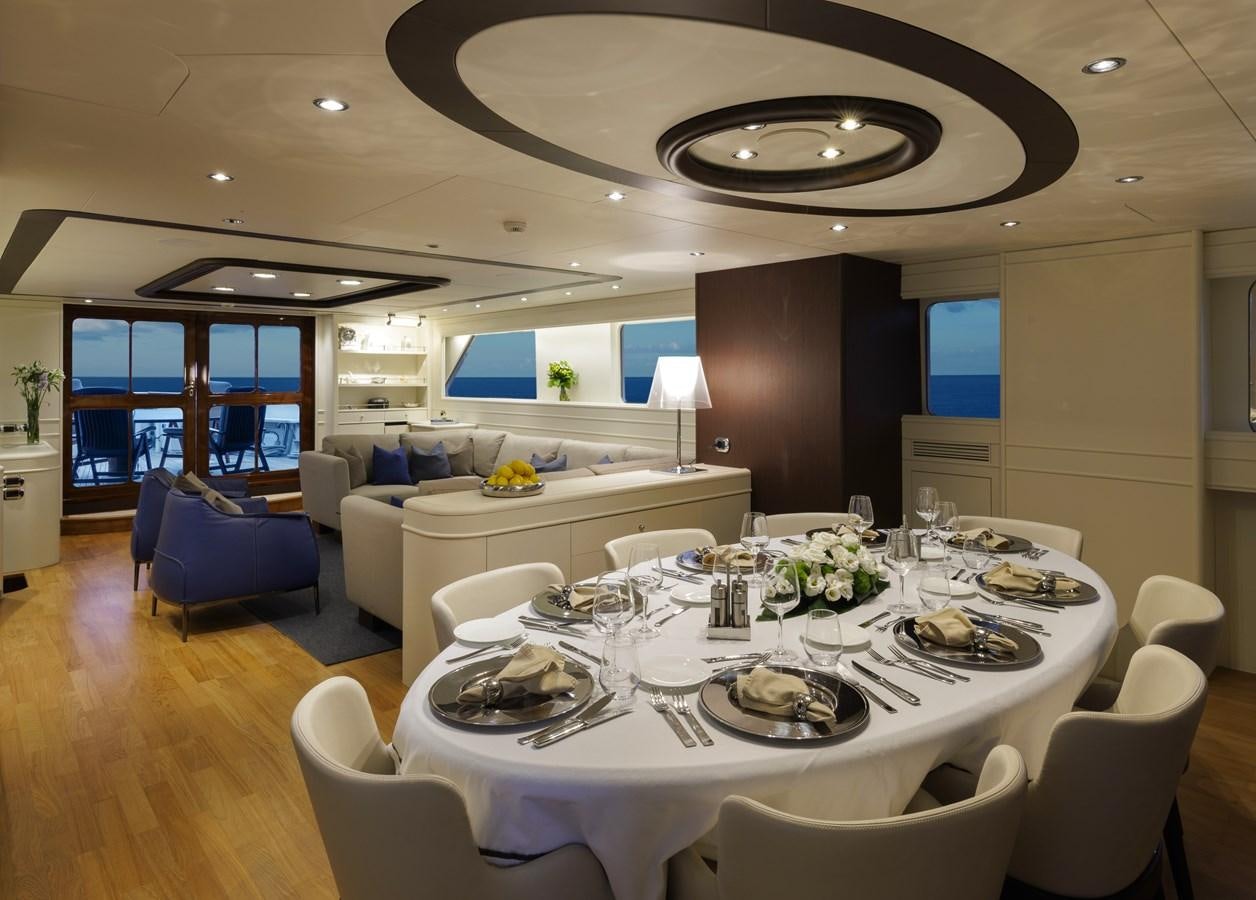 a large dining room with a large table and chairs aboard DON CIRO Yacht for Sale