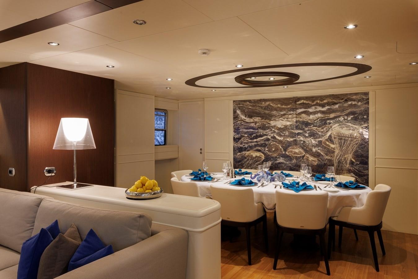 a living room with a large painting aboard DON CIRO Yacht for Sale