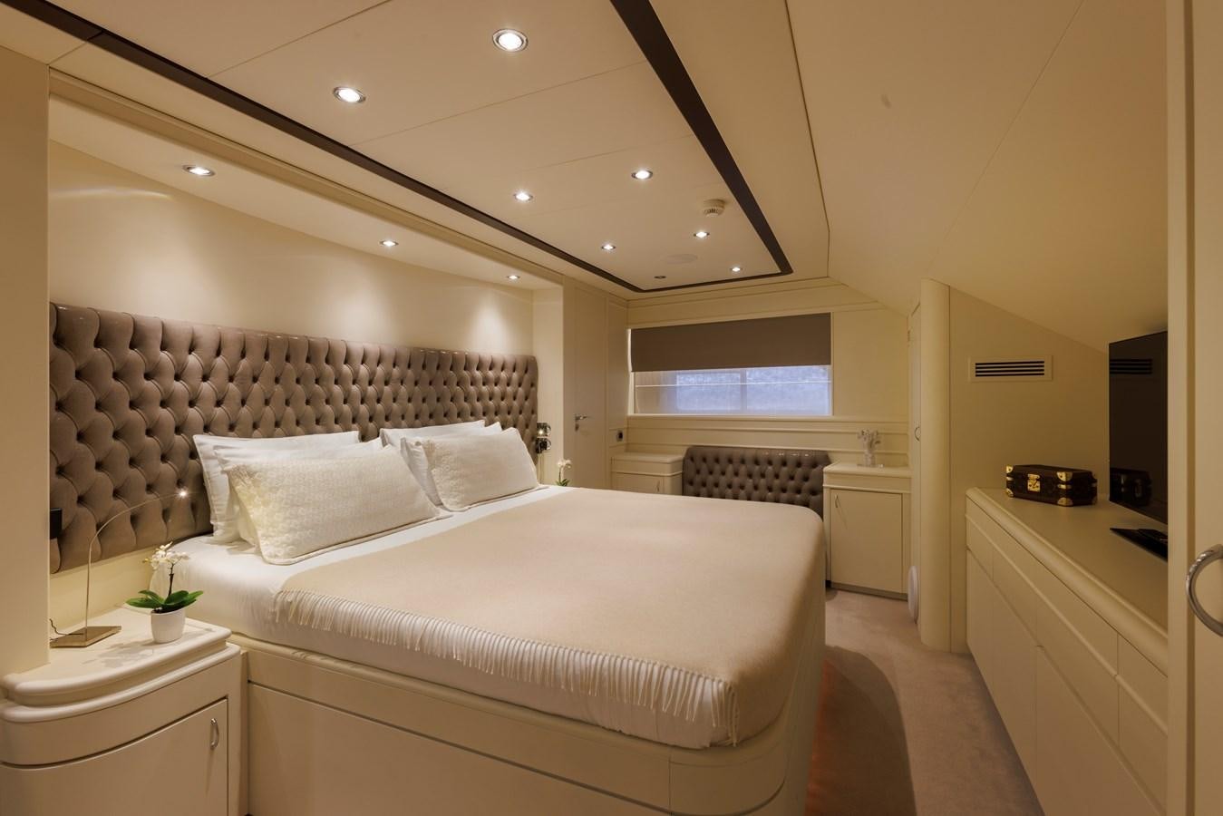 a large white bed in a room aboard DON CIRO Yacht for Sale