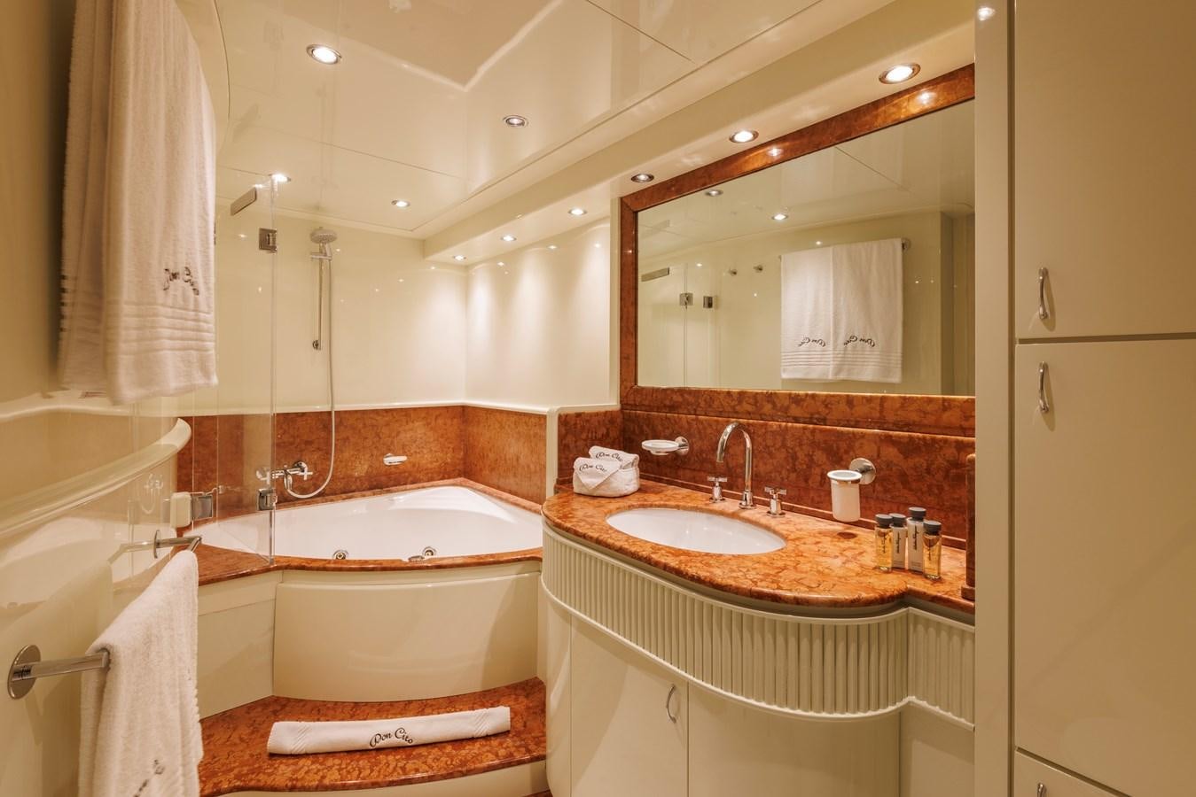 a bathroom with a large mirror aboard DON CIRO Yacht for Sale