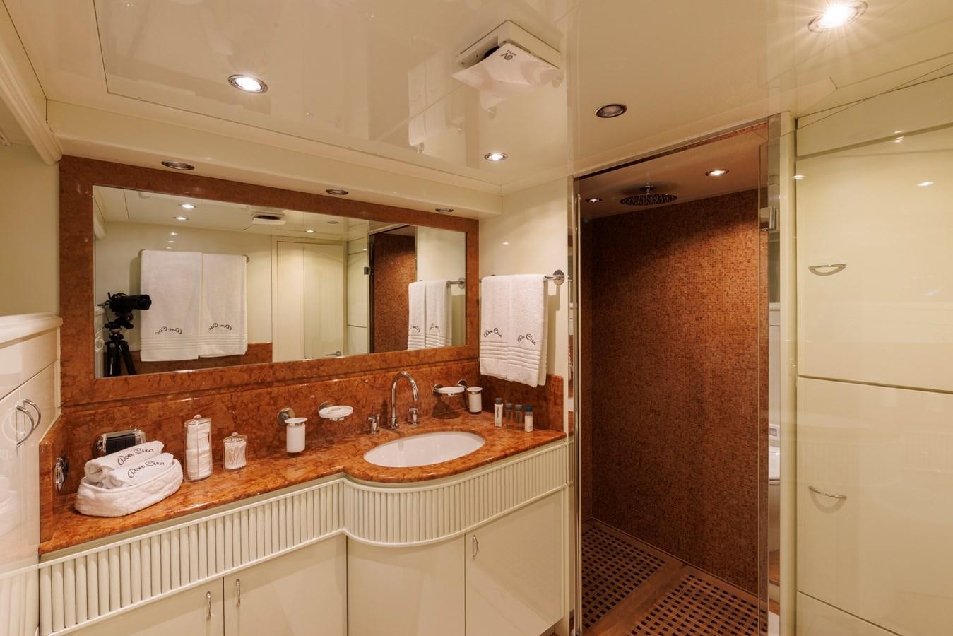 a bathroom with a sink and a mirror aboard DON CIRO Yacht for Sale