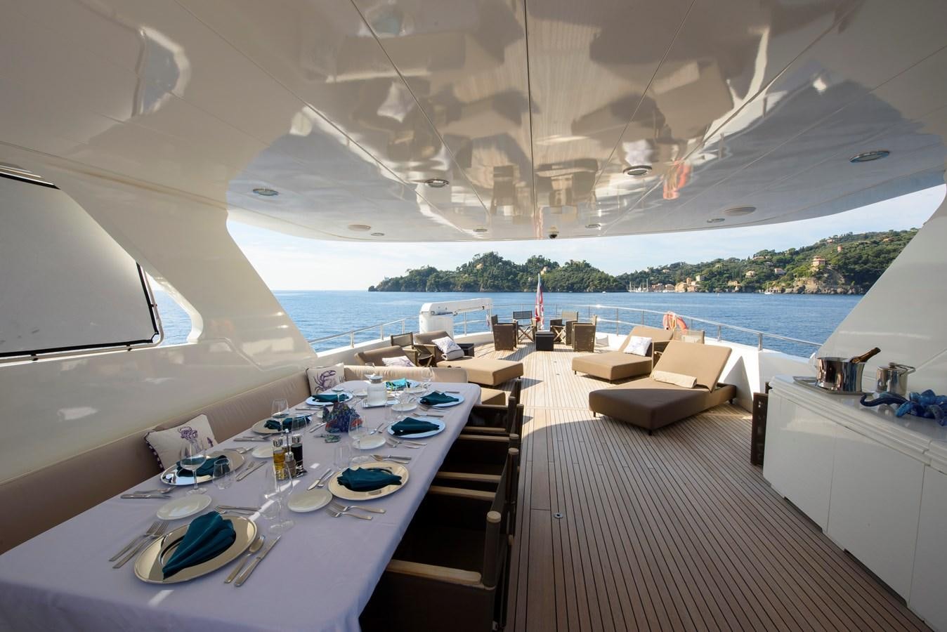 a room with a table and chairs aboard DON CIRO Yacht for Sale