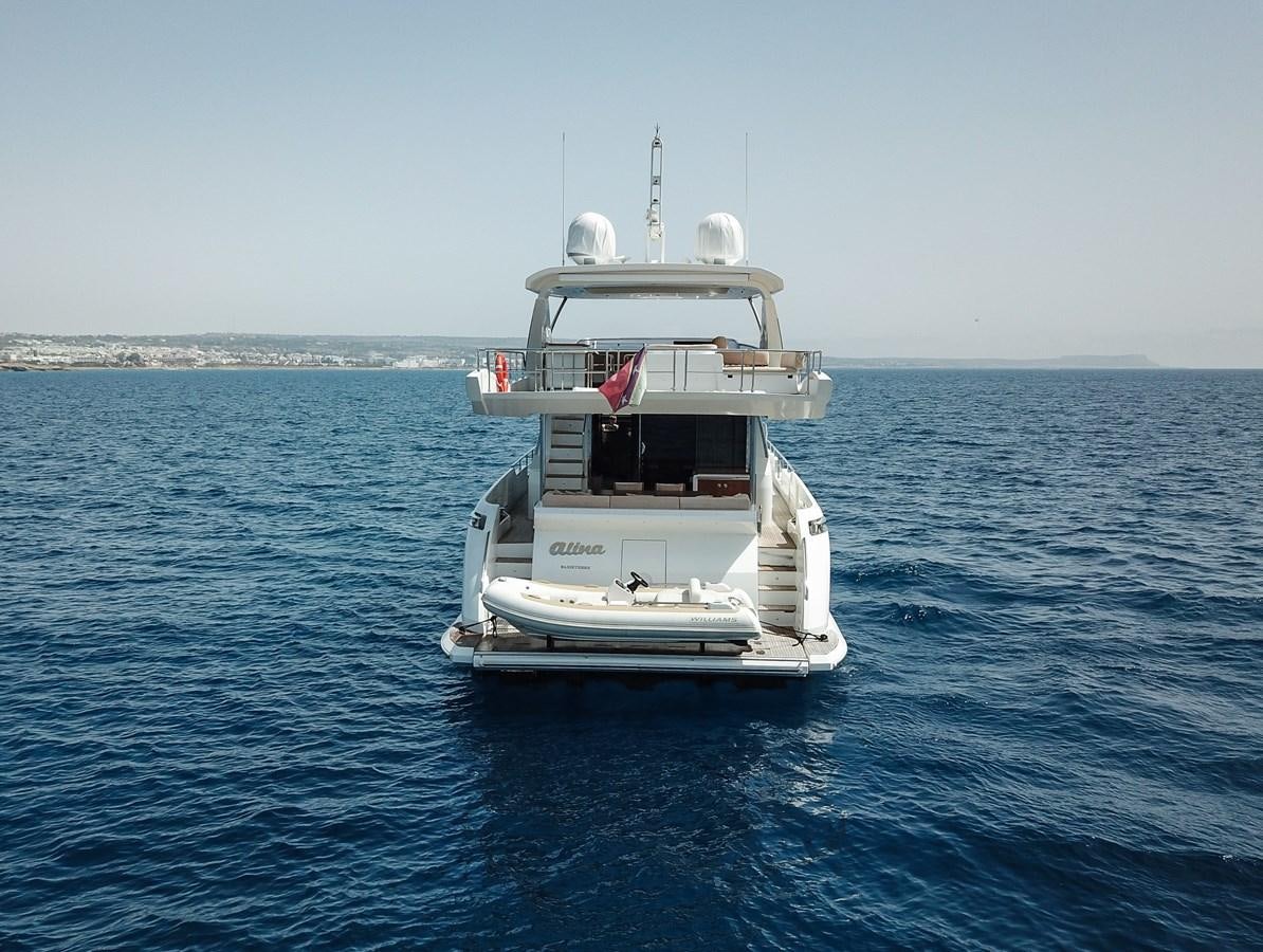 a white boat in the water aboard ALINA Yacht for Sale