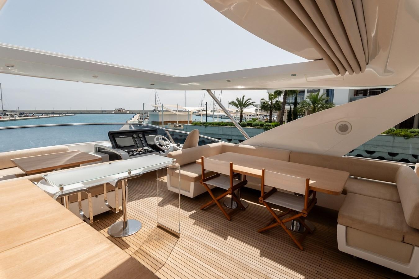 a room with a pool and a deck with chairs and a deck aboard ALINA Yacht for Sale