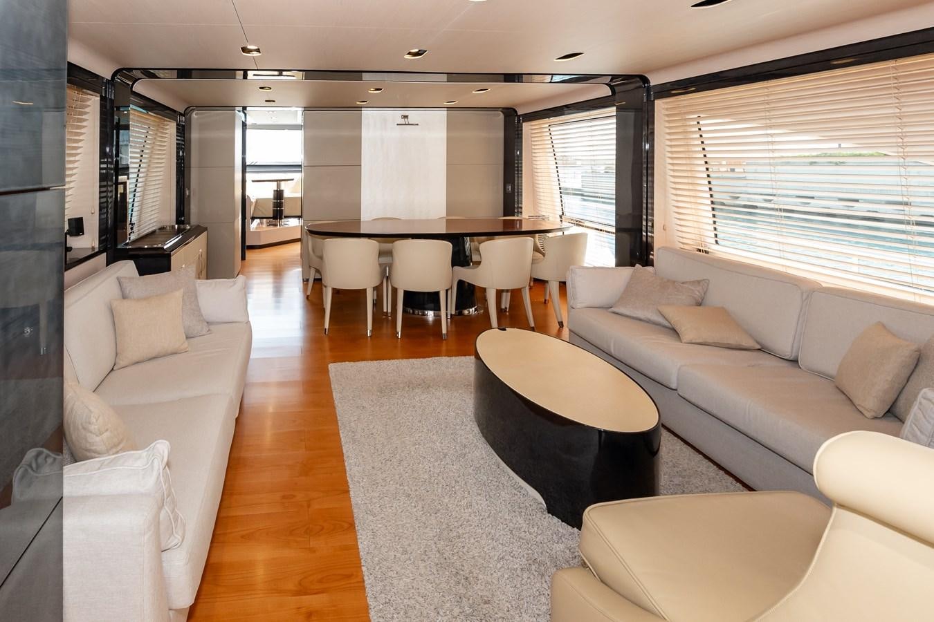 a living room with a table and chairs aboard ALINA Yacht for Sale