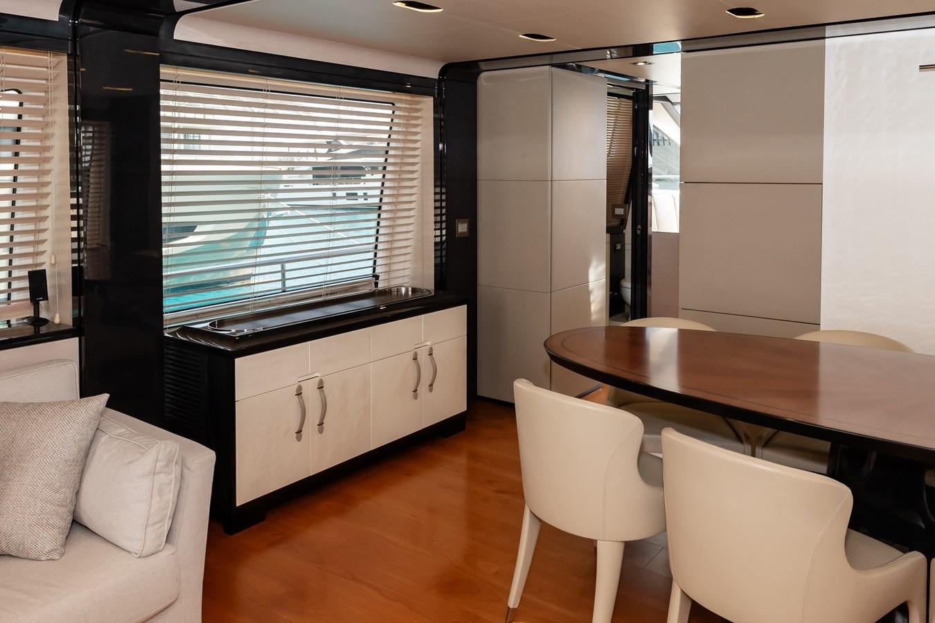 a room with a table and chairs aboard ALINA Yacht for Sale