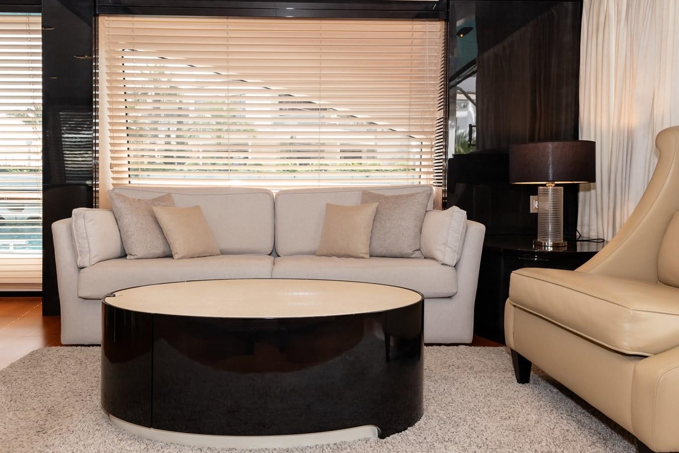 a living room with a couch and a table aboard ALINA Yacht for Sale
