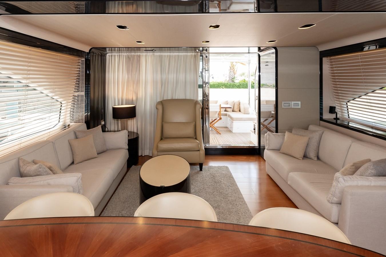 a living room with a glass door aboard ALINA Yacht for Sale