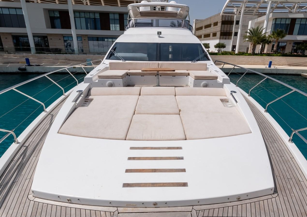 a white boat on a beach aboard ALINA Yacht for Sale