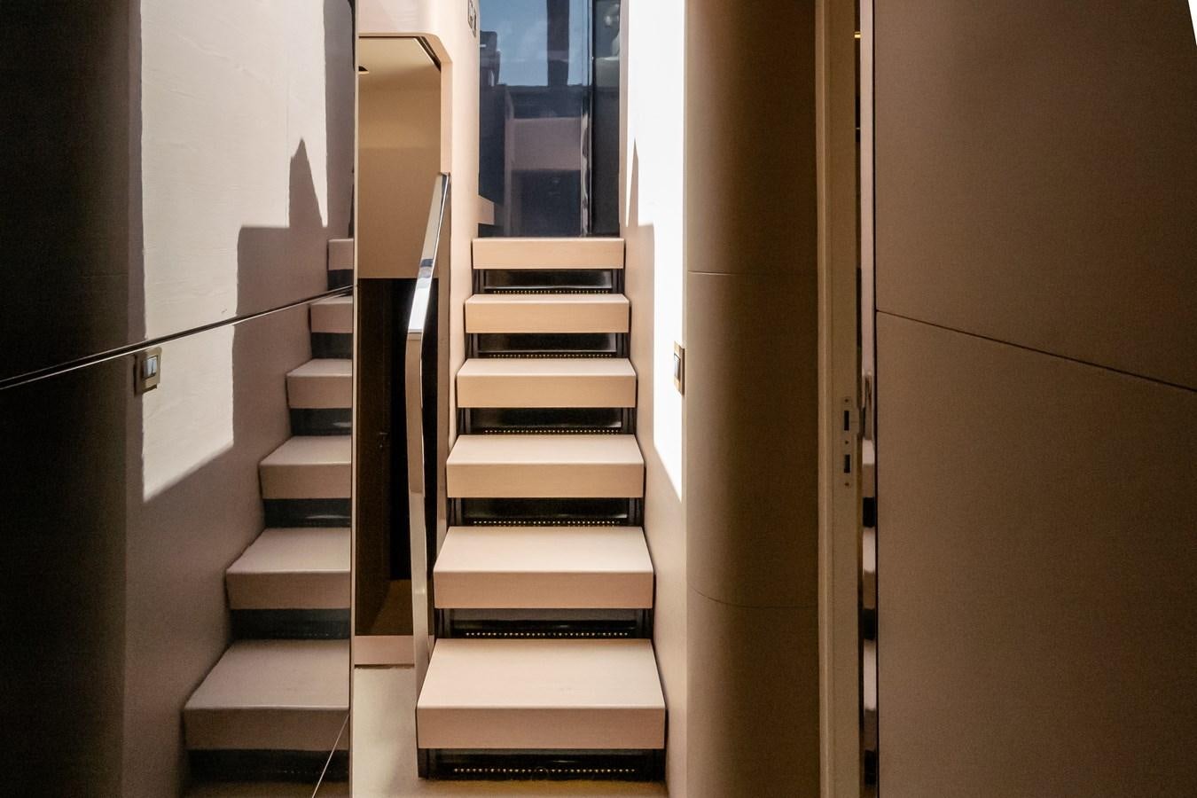 a set of stairs in a room aboard ALINA Yacht for Sale