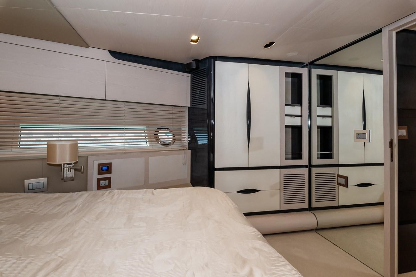 a room with a bed and a window aboard ALINA Yacht for Sale