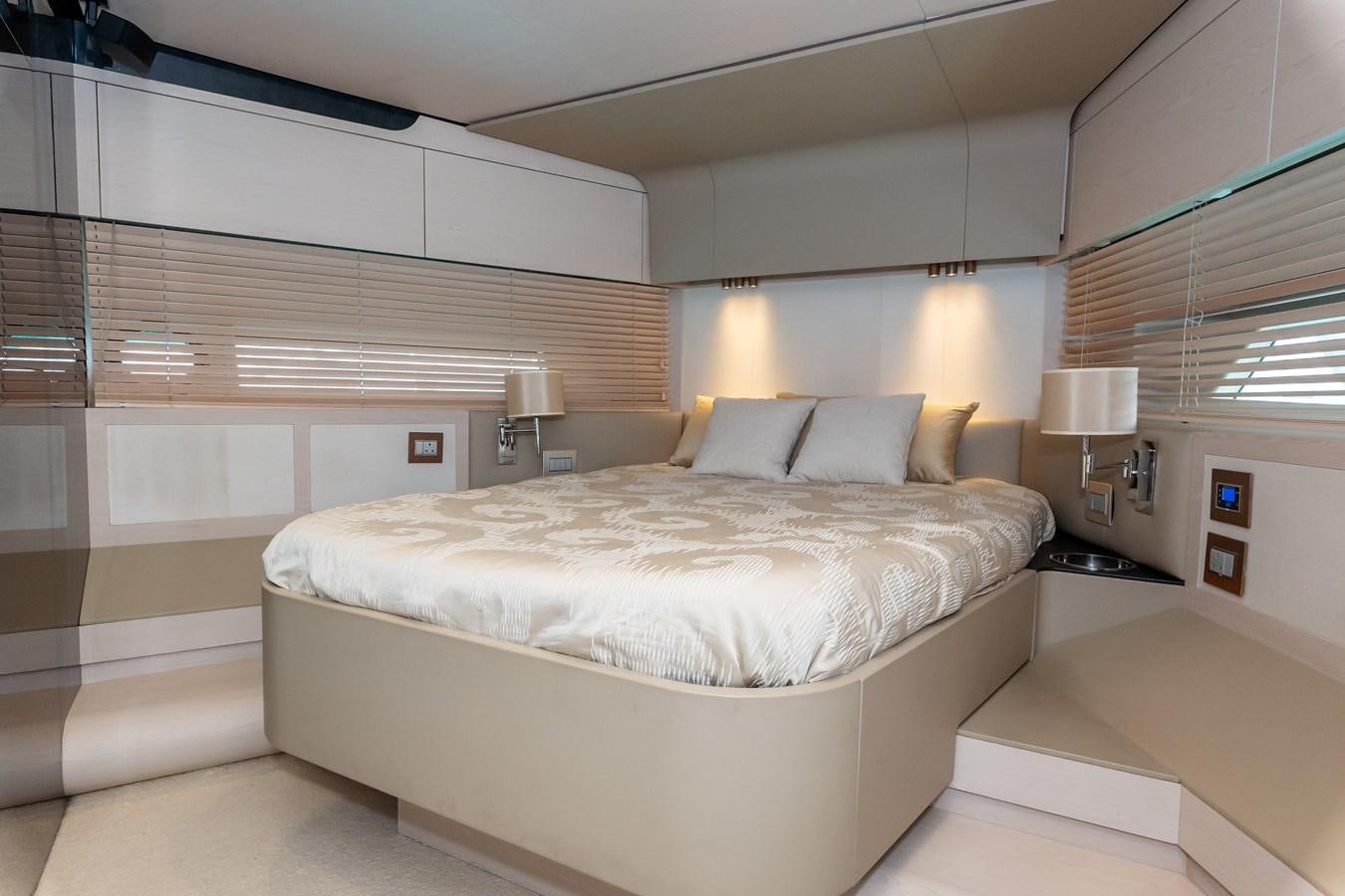 a room with a bed and a shelf with lights aboard ALINA Yacht for Sale