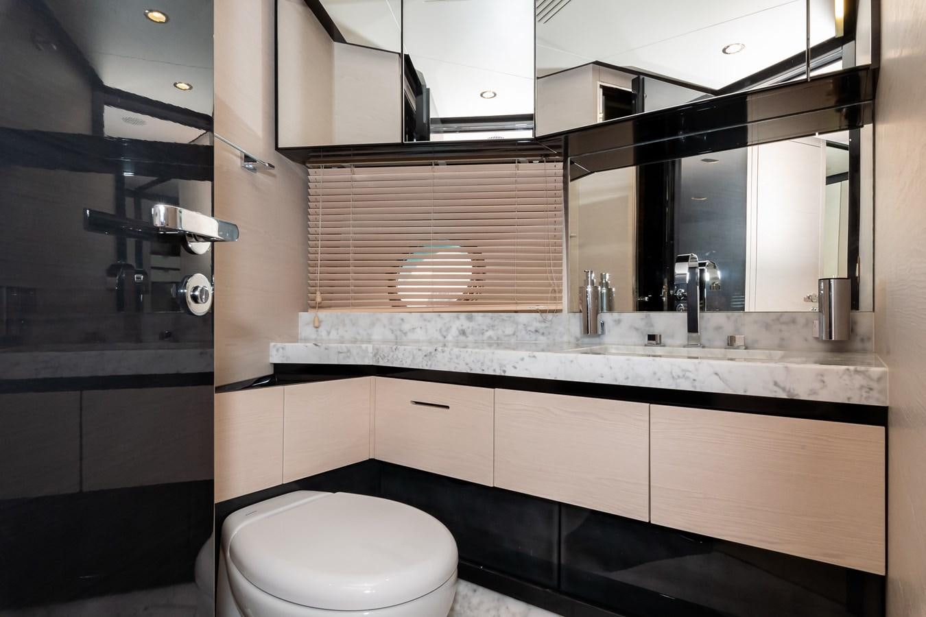 a bathroom with a large mirror aboard ALINA Yacht for Sale