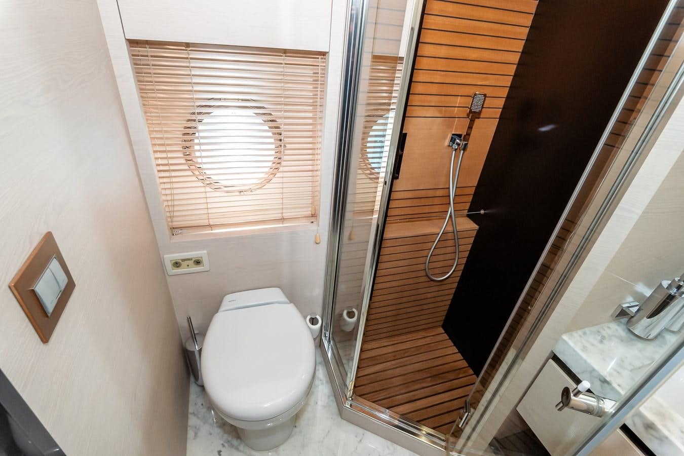 a bathroom with a glass shower aboard ALINA Yacht for Sale