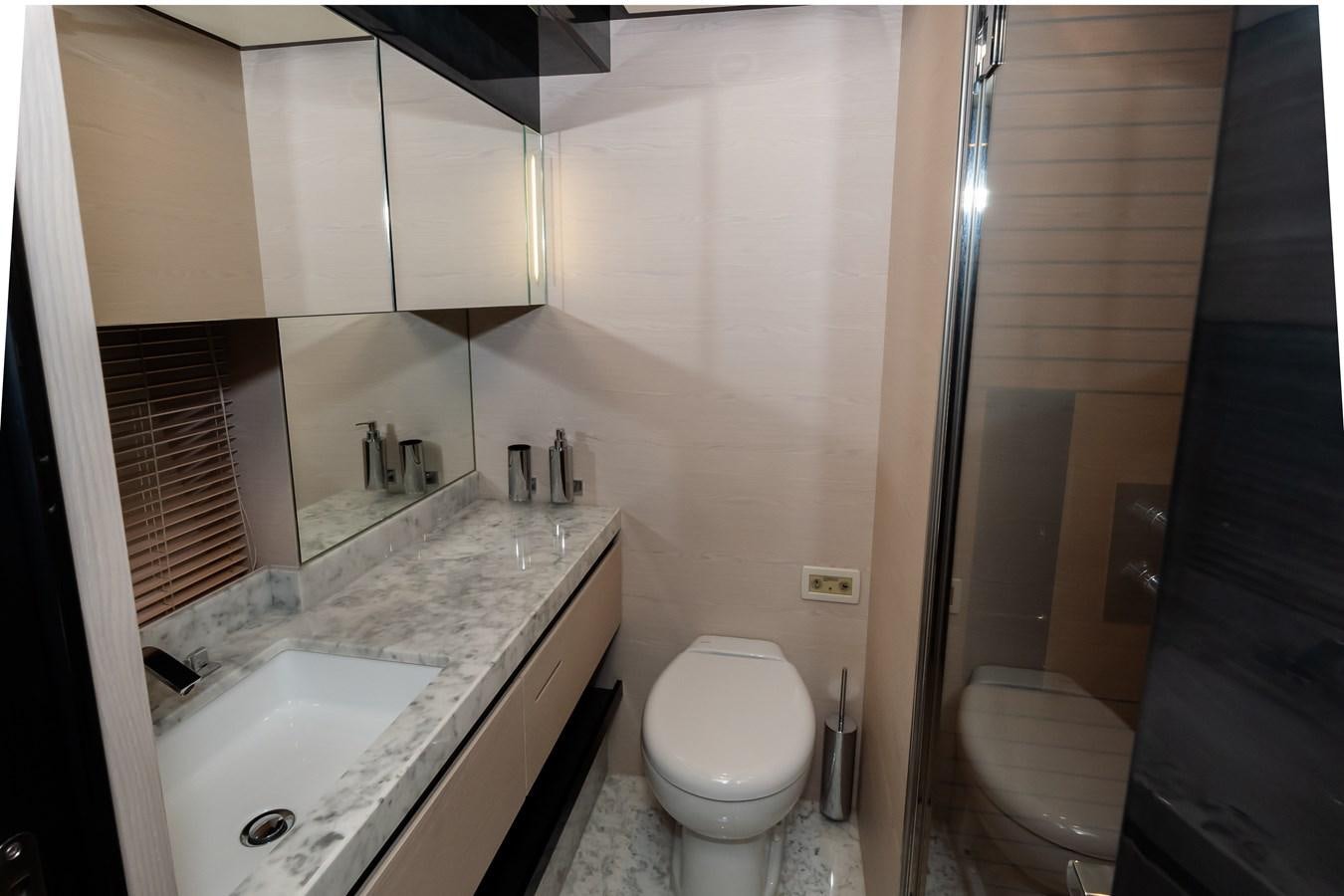 a bathroom with a sink toilet and bathtub aboard ALINA Yacht for Sale