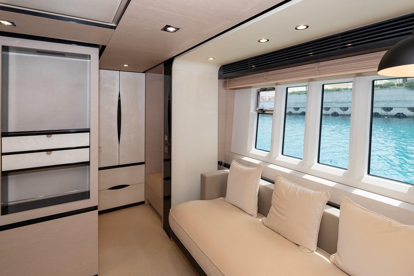 a room with a couch and a window aboard ALINA Yacht for Sale