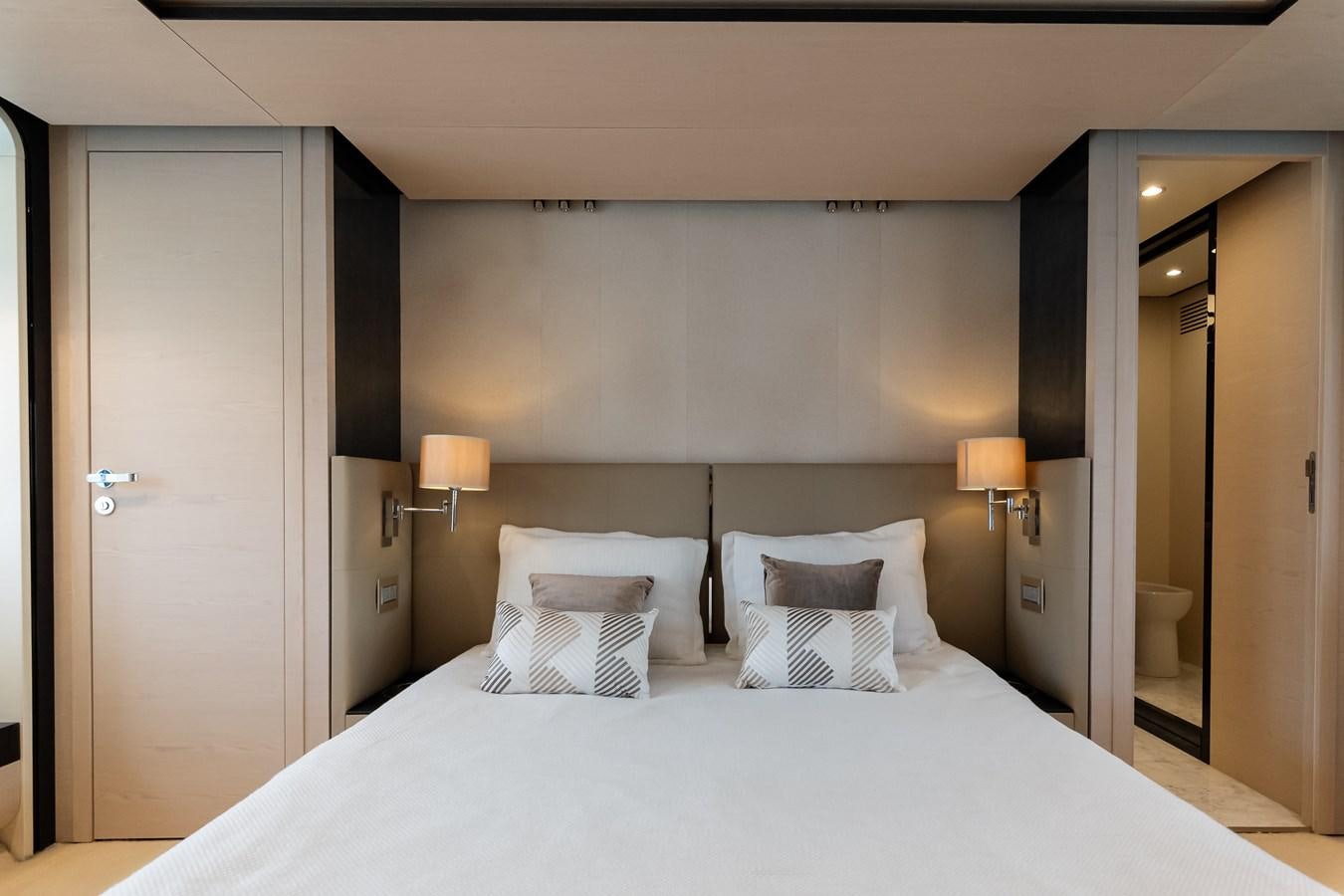 a bed with white sheets aboard ALINA Yacht for Sale