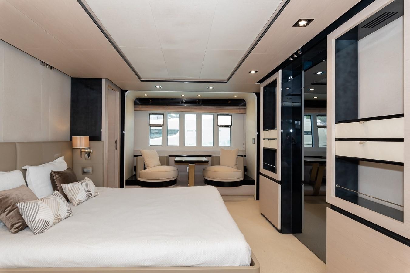 a bedroom with a bed and a mirror aboard ALINA Yacht for Sale