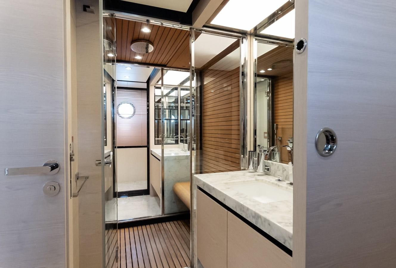 a bathroom with a large mirror aboard ALINA Yacht for Sale