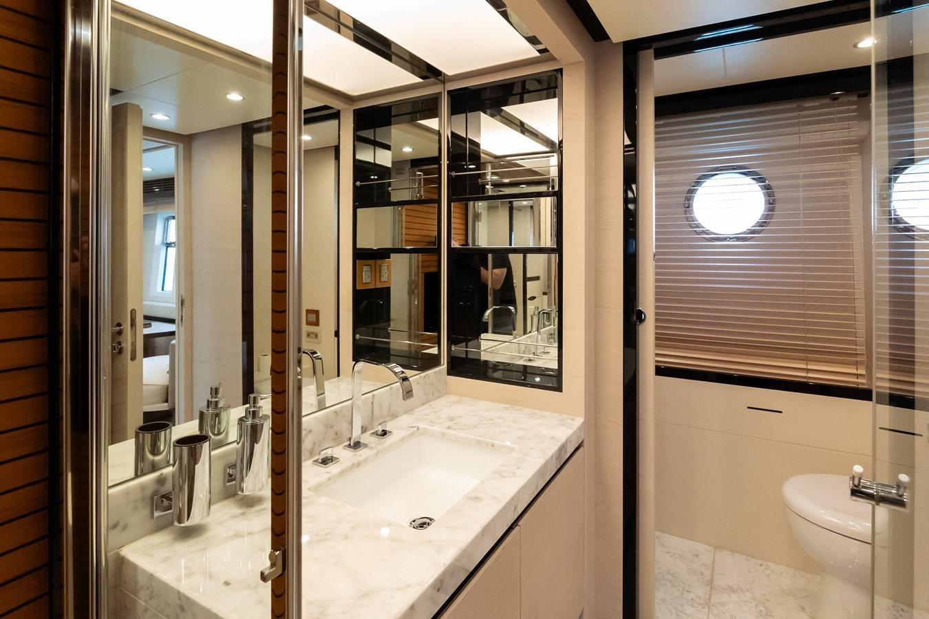 a bathroom with a large mirror aboard ALINA Yacht for Sale