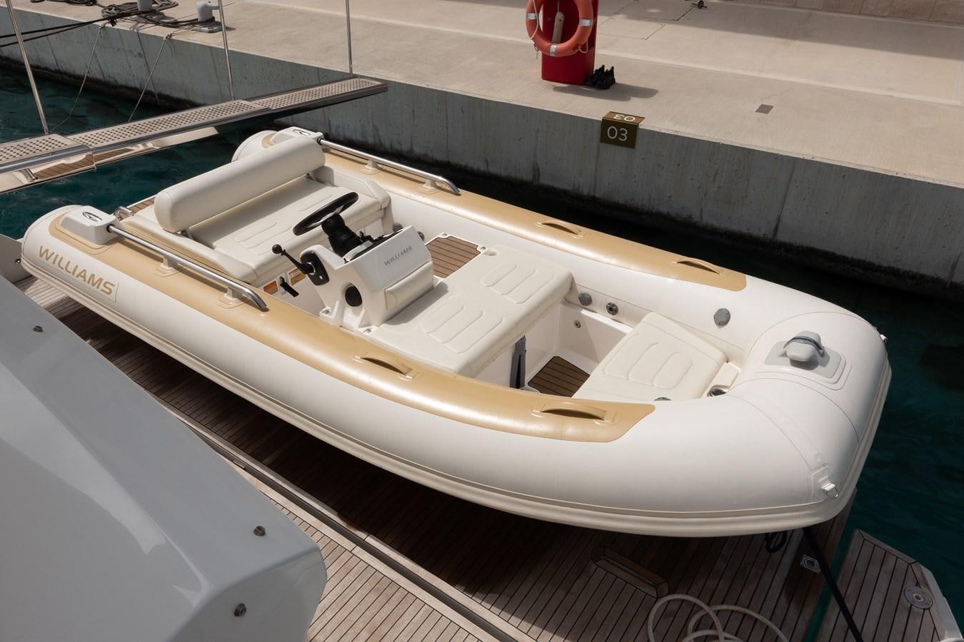 a white model tank on a white surface aboard ALINA Yacht for Sale