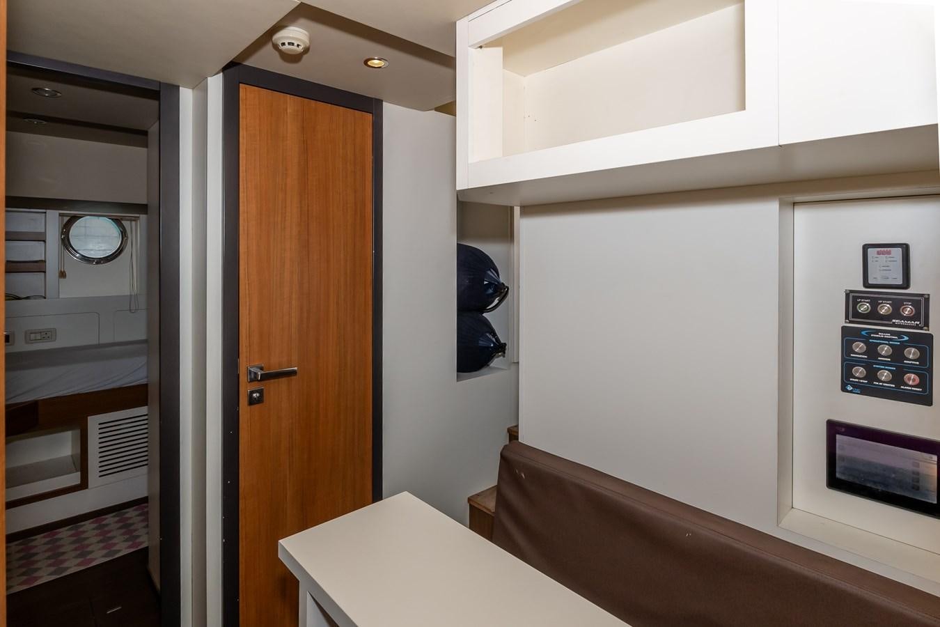 a room with a desk and a door aboard ALINA Yacht for Sale