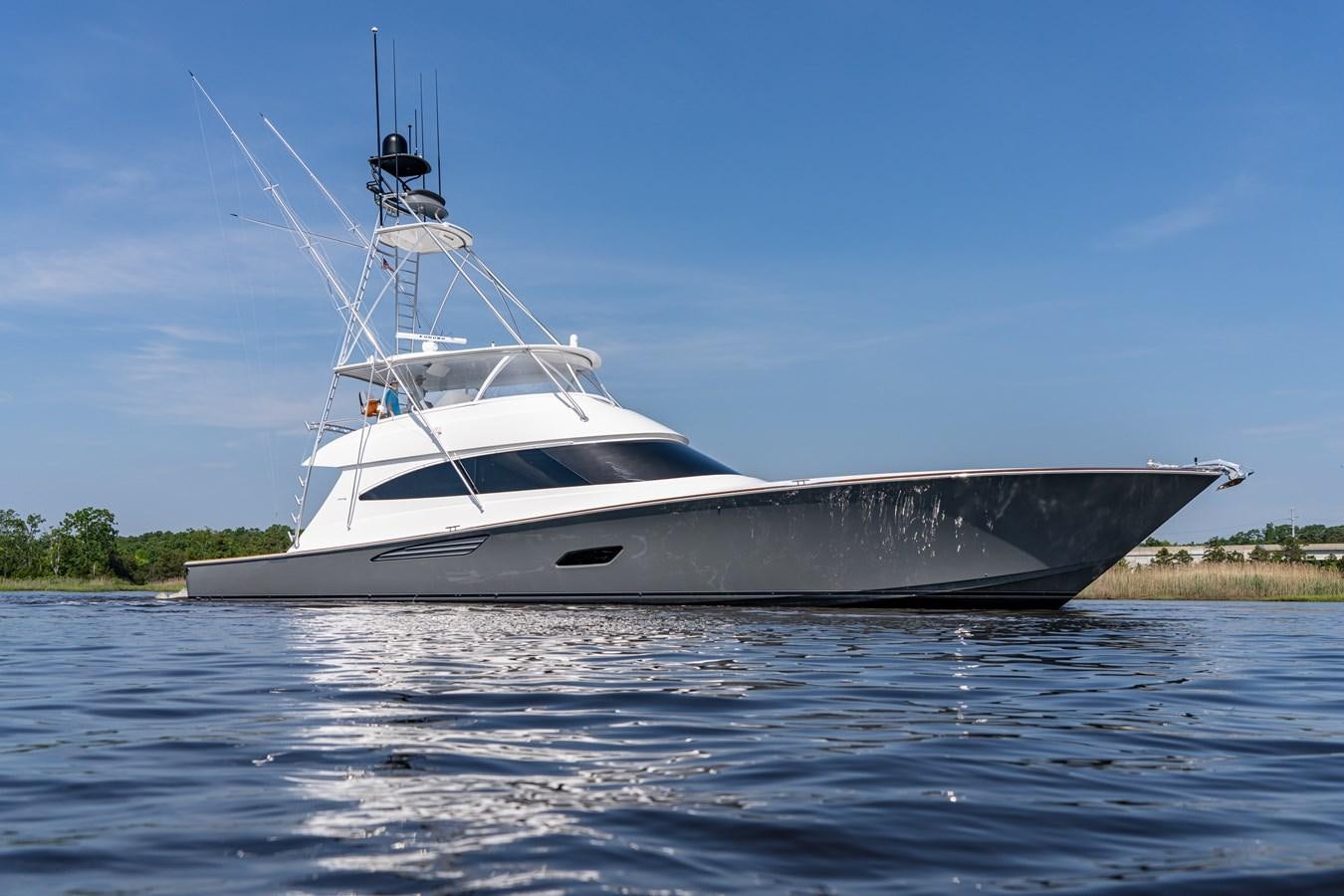 a white yacht on the water aboard FREAK SHOW Yacht for Sale