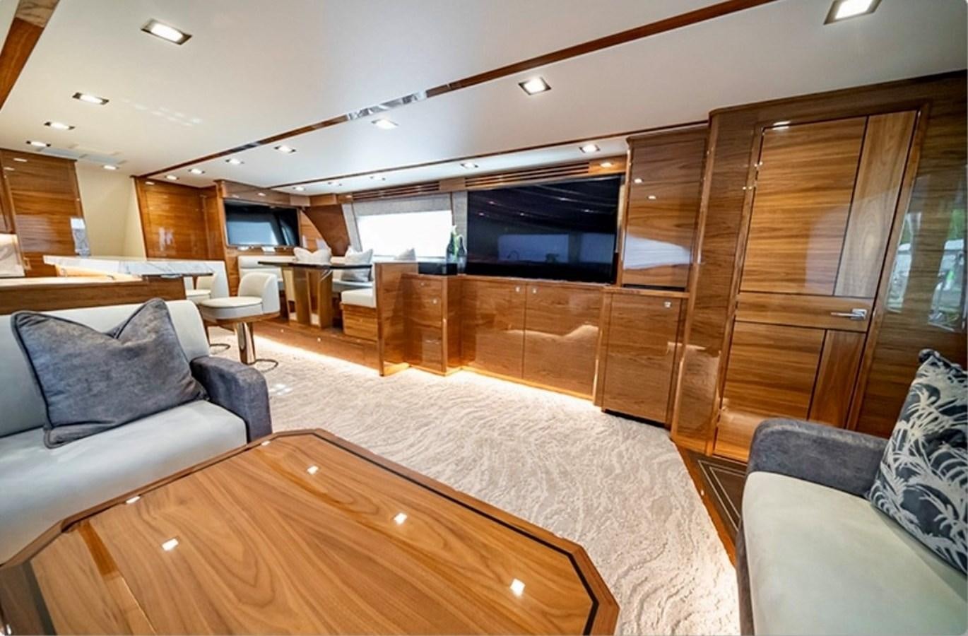 a living room with a glass wall aboard FREAK SHOW Yacht for Sale