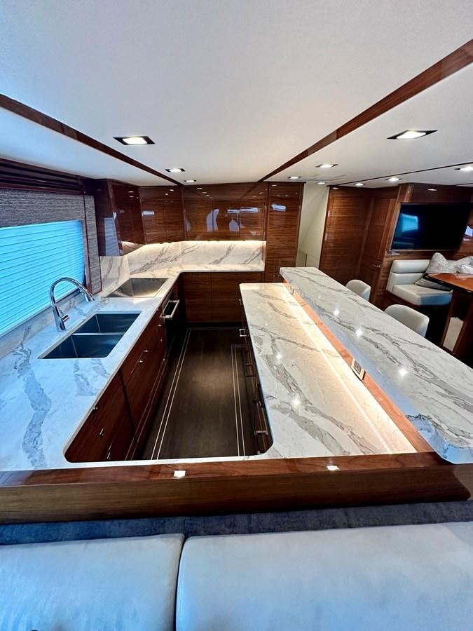 a large kitchen with a wood floor aboard FREAK SHOW Yacht for Sale