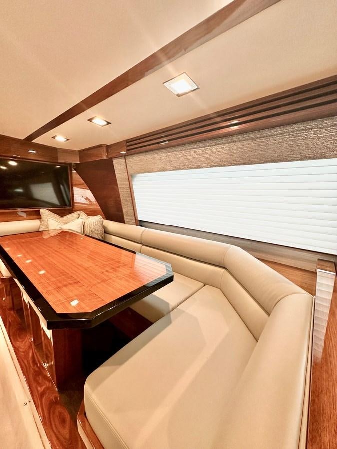 a room with a table and chairs aboard FREAK SHOW Yacht for Sale